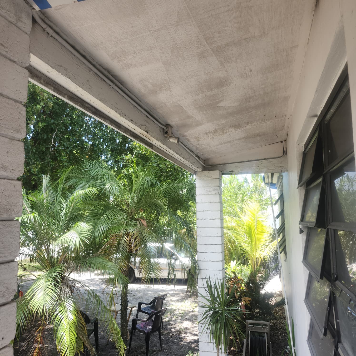 Exterior soffit and wall beneath a covered Palm Beach Gardens porch