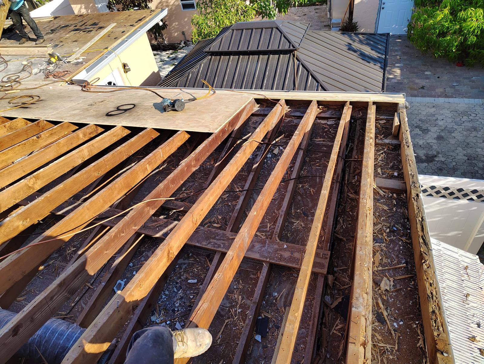 Aged roof decking exposed after old roofing materials were removed